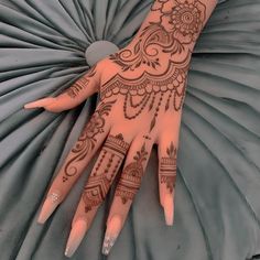 a henna tattoo on the palm of someone's hand