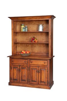 an old fashioned wooden hutch with fruit on the top and two shelves above it