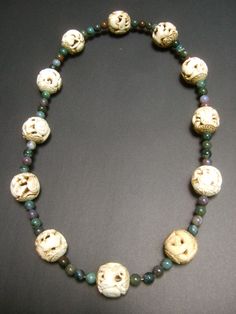 "Massive vintage Chinese artisan zodiac jade beaded necklace The beautiful necklace is embellished with intricately carved ox bone beads depicting the twelve zodiac animals Interspersed within the exotic carved ox bone beads are smaller semi-precious jade beads in muted greens & brownish gray hues The word zodiac derives from the Greek meaning \"circle of figures\" In Chinese terms each of the carved zodiac ox bone beads is represented by an animal beginning with the rat, followed by the ox, Traditional Jade Necklace With Gemstone Beads, Traditional Jade Beaded Necklaces, Traditional Hand-strung Jade Beaded Necklace, Artisan Carved Necklaces With Round Beads, Artisan Carved Round Bead Necklaces, Traditional Jade Beaded Necklaces With Gemstone Beads, Traditional Handmade Jade Beaded Necklaces, Traditional Carved Beaded Necklaces For Jewelry Making, Unique Jade Beaded Necklace With Round Beads