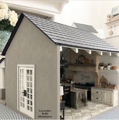 a doll house with a kitchen inside of it