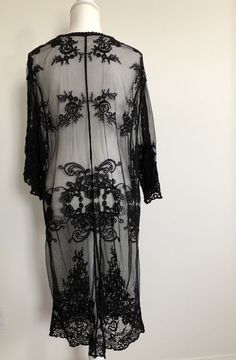 "Bohemian style sheer lace cardigan features a tie front and kimono style in a relaxed fit. It's beautifully made in delicate embroidered sheer lace all over. Can be dressed down or dress up -- made a romantic cover up for a summer night outing, a party, or just to the beach! ONE SIZE FITS MOST - SMALL, MEDIUM LARGE Length: 44\" Bust: 20\" (tie front, one size fits all) Sleeve length: 17\" Armhole : 11\"" Sheer Lace For Spring Party, Bohemian Fitted Sheer Cover-up, Fitted Lace Cover-up With Lace Trim, Festival Open Front Cover-up, Sheer Long Sleeve Festival Cover-up, Bohemian Lace Top For Party, Bohemian Sheer Cover-up For Party, Bohemian Lace Cover-up With Lace Trim, Bohemian Lace Cover-up For Party