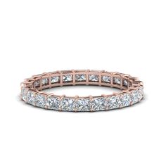 a rose gold band with princess cut diamonds in the center and rows on each side