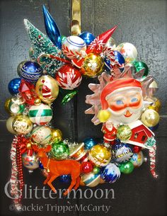 a christmas ornament wreath on a door