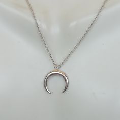 A Sterling silver neck chain with a crescent moon charm. Dimensions: 14.5 x 15.5 mm Length: 16 to 17 inches This necklace is made of 925 hypoallergenic sterling silver. Most of my pieces come with a 925 stamp. Please go through all the pictures posted for this item to gauge the actual size. Can be packaged in a gift box. I can include a personal message from you if needed You are welcome to contact me at... bhavnakwintra1956@gmail.com For more beautiful pieces from my shop, please browse 👇 SILV Silver Crescent Sterling Silver Charm Necklace, Silver Crescent Moon Phase Charm Necklace, Minimalist Crescent Moon Phase Charm Necklace, Silver Dainty Moon Charm Necklace, Dainty Silver Necklace With Moon Charm, Silver Charm Necklace With Moon Phase Round Pendant, Silver Charm Necklaces With Moon Phase For Everyday, Silver Crescent Charm Necklace For Everyday Wear, Silver Moon Phase Charm Necklaces For Everyday