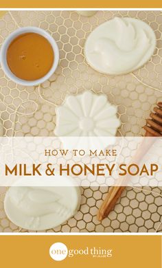 the words how to make milk and honey soap on a table with honey combs