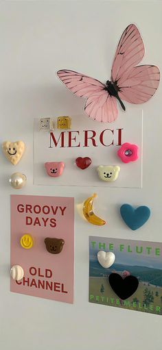 there are many pins and magnets on the wall