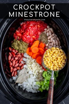 the crock pot is filled with different types of vegetables and beans, including carrots