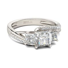 an engagement ring with three princess cut diamonds on the sides and two side stones in the middle