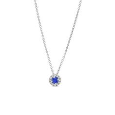 Adorn yourself with elegance using our white gold necklace featuring a stunning blue sapphire surrounded by a halo of diamonds. Formal Sapphire Necklace With Halo Setting, Formal Blue Necklace With Halo Setting, Formal Blue Necklaces With Halo Setting, Sapphire Necklace With Diamond Halo Setting, Sapphire Pendant Necklace With Halo Setting, Blue Platinum Necklace With Brilliant Cut, Blue Brilliant Cut Platinum Necklace, Sapphire Necklaces With Halo Setting, Blue Platinum Jewelry With Pave Setting