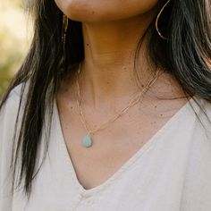 This beautiful Christine necklace features a single, dangling crystal pendant. It's perfect for everyday wear and can be dressed up or down to suit your style. The gold chain is approximately 16 inches long with a 2-inch extender, so it will fit comfortably on most anyone. Choose your favorite stone pendant from amazonite, cherry quartz, or mother of pearl. Shop now for this must-have necklace! Hypoallergenic 14k Gold-filled Round Pendant Jewelry, Hypoallergenic 14k Gold Filled Round Pendant Jewelry, Hypoallergenic 14k Gold Filled Round Pendant, Everyday Hypoallergenic Round Pendant Necklaces, Hypoallergenic 14k Gold-filled Round Necklace, Everyday Hypoallergenic 14k Gold-filled Charm Necklaces, Hypoallergenic 14k Gold Filled Necklaces, Hypoallergenic 14k Gold-filled Necklace, Gold Charm Necklaces For Everyday