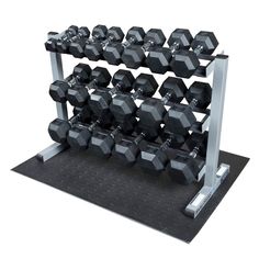 a pair of dumbbells sit on a metal rack in front of a white background