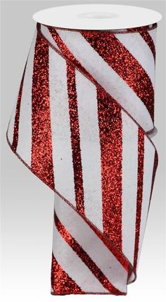 a red and white striped ribbon with glitter on it