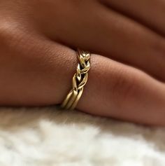 A most beautiful 14 karat solid gold ring, made of three wires and braided in the front. A timeless ring that looks delicate yet very impressive. A perfect wedding band that makes a great anniversary gift. Width: 4 mmHere is the silver version:https://www.etsy.com/il-en/listing/386710034/minimalist-ring-braided-silver-ring?ref=shop_home_active_7&frs=1Here is the link for the male version:https://www.etsy.com/il-en/listing/182853264/men-silver-ring-male-silver-ring-mens?ref=shop_home_active_4 Braided Wedding Ring, Braided Wedding Rings, Couple Rings Gold, Gold Wedding Band Women, Braided Wedding Band, Ring Gold Wedding, Wedding Ring Gold, Minimalist Silver Ring, Gold Wedding Bands Women