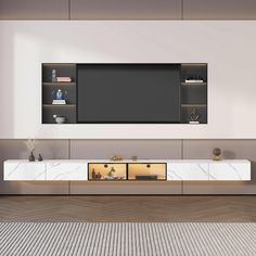 a tv is mounted on the wall above a white entertainment center with marbled drawers