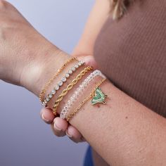 September’s Butterfly of the Month Bracelet features an Emerald Swallowtail Butterfly charm on a dual-layer adjustable chain bracelet. This stack showstopper is perfect for any occasion with its delicate, faceted clear glass bead layer and a classic gold chain. Embrace the transformative power of this symbol with a buffed epoxy butterfly charm in gorgeous green hues that stand out with vibrant beauty. Chain length: 6.5" - 8" Finishes: Shiny Gold Nickel-free Adorned with Clear crystals Epoxy Butterfly, Emerald Swallowtail, Butterfly Charm Bracelet, Swallowtail Butterfly, Moon Sun, Butterfly Bracelet, Stylish Rings, Green Hues, Travel Jewelry Case