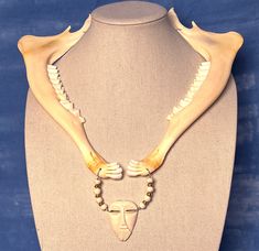 "This Artisan Bone Beads necklace features: Themes: Protection; Connection With the Ancestors; LIGHTWEIGHT This strandis about 21\" Inside Diameter (measurement of the part closest to your neck, not counting drops and focal beads though this one is tricky to assign a value) and features: Mule Deer Jawbones (matched, from same deer) Bone Beads African Brass Cicone spacer beads This is a part of my Artisan Collection and is a One of a Kind creation! #ooakjewelry #shaman #ooaknecklace #soundhealing Animal Bones Jewelry, Bone Jewellery, Bone Fashion, Real Bone Jewelry, Animal Bone Jewelry, Bone Accessories, Bone Bead Necklace, Leg Bones, Wire Wrapped Jewelry Diy