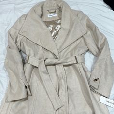 Calvin Klein Coat Bought At Macy’s. Size Xl. Cream Color. Never Worn. New With Tags. Calvin Klein Beige Outerwear For Spring, Calvin Klein Beige Spring Outerwear, Fitted Beige Calvin Klein Outerwear, Calvin Klein Beige Outerwear For Work, Calvin Klein Fitted Fall Outerwear, Fitted Calvin Klein Outerwear For Fall, Calvin Klein Beige Long Sleeve Outerwear, Calvin Klein Casual Beige Outerwear, Casual Beige Calvin Klein Outerwear