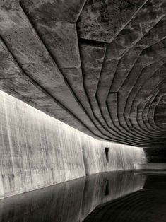 an underpass with water underneath it