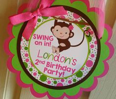 a pink and green monkey birthday party decoration