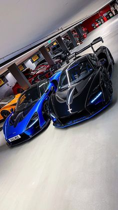 two exotic sports cars parked next to each other