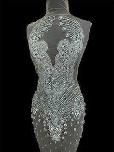 the back of a dress with beading and sequins