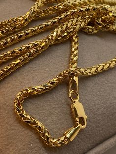 "18k 18k Gold Foxtail Round Necklace ,22\",3mm,8.15 gr 18k Gold Foxtail Round Necklace ,20\",3mm,7.41gr 18k Gold Foxtail Round Necklace ,18\",3mm,6.51gr 14k  14k Gold Foxtail Round Necklace ,22\",4mm, 9.47 gr  14k Gold Foxtail Round Necklace ,20\",4mm,8.50 gr 14k Gold Foxtail Round Necklace ,18\",4mm,7.50 gr This is a Trending Etsy Bestselling Franco Necklace. It is made with Authentic Genuine Real 18K Gold. Easy to layer! Looks beautiful with your favorite charms or even if you wear it alone. BEST PRICE ON ETSY FOR SOLID 18kGOLD FRANCO NECKLACES! Premium spring ring Hook for added safety! Priced to sell! Compare our prices to other similar sellers! Arrives in a GIFT BOX and includes FREE SHIPPING within the USA and Canada. International shipping is available at the most economical rates o Luxury Wheat Chain Necklace As Gift, Luxury Wheat Chain Necklace For Gift, Luxury Gold Chain Herringbone Necklace As Gift, Luxury Herringbone Necklace With Gold Chain As Gift, Gold Snake Chain Necklace With Lobster Clasp As Gift, Yellow Gold Herringbone Necklace With Box Chain For Gift, Gold Plated Wheat Chain Necklace, Gold Plated Wheat Chain Necklace As Gift, Gift Gold Plated Wheat Chain Necklace