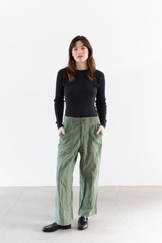 These army high waist pants feature four pockets, belt loops, zipper fly. SO comfortable. Perfectly faded with areas of wear. Maker: Military  |  Made in the USA in the 60s   |  Material: 100% Cotton super soft Condition: Good. With wear on the pockets including a mend on front left pocket. Some areas of fading. Waist: 28"  |  Hips: 43"  |  Rise: 12.25"  |  Inseam: 28"  |  Thigh: 12.5" at widest   |  Leg Opening: 9" Cassie is 5'8" and wears modern 2 with 26-27" waist and 36" hip. These were over Military Style Straight Leg Bottoms For Fall, Military Wide-leg Bottoms With Patch Pockets, Military Style Wide Leg Bottoms With Patch Pockets, Military Style Full-length Bottoms With Patch Pockets, Military Style Full-length Bottoms For Fall, Military Style Wide Leg Pants With Belt Loops, Military Style Full Length Bottoms With Patch Pockets, Utility Style Wide Leg Pants With Zip Fly, Utility Wide Leg Pants With Zip Fly