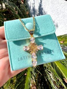 Virgin Mary And Cross Necklace. Beautifully detailed in Zircon crystals to create a beautiful design. A perfect gift for yourself or a loved one.  Material:  Pendant: Zircon Chain: 18k Gold plated, Stainless Steel Size: 50 cm  Figaro chain 3mm width Packaging: Our jewelry comes in a microfiber velvet case to keep your jewelry safe from scratching. Perfect for gift-giving and reusable packaging. Message us if you would like us to record your order on TikTok! Follow us on Instagram and Tiktok @lat Spiritual Crystal Jewelry Gift, Oval Rhinestone Jewelry Gift, Spiritual Crystal Jewelry For Gifts, Oval Shaped Rhinestone Jewelry For Gifts, Spiritual Crystal Jewelry As A Gift, Crystal Cross Jewelry As A Gift, Crystal Cross Jewelry For Gifts, Crystal Cross Jewelry For Jewelry Making, Rhinestone Cross Pendant Jewelry Gift