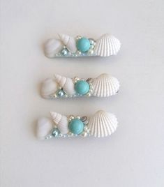 Haarkamm Maritime, Strandhochzeit, Braut Muscheln   Seashell hair clip, Beach wedding,Beach hair accessory,Seashell Hair accessories,Mermaid hair pin, shell bridal aligator hair clip,Headpiece  These beautiful sea shell hair clip will make a great statement on your special day and beach wedding. This romantic Sea Shell hair accessory is decorated with pearl beads, natural sea snail and natural sea shells. A magnificent beach accessory for bride and bridesmaid. This is listing is for 3pcs. hair c Seashell Hair Accessories, Seashell Hair, Beach Hair Accessories, Mermaid Seashell, Bridal Hair Clip, Mermaid Hair, Beach Accessories, Brides And Bridesmaids, Beach Hair