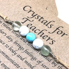 "(Gift wrap available at check out) If you need more than 1 gift wrap, please buy them separetly in my shop. You'll find the option under the section \"Gift Wrap\") This Crystal bracelet has been designed to support teachers in their day to day job, to keep them relaxed, positive and happy so to give their best and to enjoy their demanding job. This bracelet is made up of Howlite, Turquoise and Fluorite crystals beads.  These crystal are traditionally associated with teaching and they are known to provide a general sense of well being. All my crystals are natural in order to preserve all their qualities. *Please note that fluorite, (the two beads on the sides) comes in many colors which they will be selected randomly (shades of green, purple, pink, blue, light yellow, transparent)* Crystal Adjustable Healing Jewelry Gift, Adjustable Healing Jewelry As A Gift, Gift Crystal Bracelet, Natural Stones Bracelets For Mother's Day, Natural Stone Bracelets For Mother's Day Gifts, Mother's Day Gift Bracelets With Natural Stones, Spiritual Beaded Bracelets For Mother's Day Gift, Mother's Day Gift Crystal Round Bracelet, Mother's Day Gift Crystal Bracelet