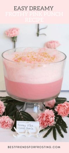 a pink dessert in a glass dish with flowers around it and the words easy dreamy frost