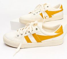 Based on an original style from 1975 that was worn by tennis player, Mark Cox, this ladies' tennis-inspired plimsoll features an  off-white upper, contrasting wing flash, and signature Gola branding. From Gola. Gola Hawk Sneakers Outfit, Gola Daytona Sneakers, Gola Tennis Shoes, Gola Sneakers High Tops, Gola Sneakers, Ladies Tennis, Vegan Sneakers, Tennis Sneakers, Girls Sneakers