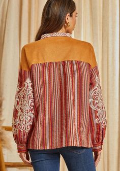 This beautiful striped pattern blouse features a suede panel with lace up detail. This top features gorgeous embroidery with long sleeves. One of a kind. Non sheer, woven. Brown Floral Embroidered Long Sleeve Top, Brown Long Sleeve Top With Floral Embroidery, Brown Patchwork Long Sleeve Blouse, Bohemian Long Sleeve Top With Lace Patchwork, Bohemian Long Sleeve Tops With Lace Patchwork, Bohemian Tops With Lace Patchwork For Fall, Bohemian Lace Patchwork Tops For Fall, Long Sleeve Blouse With Lace Patchwork For Fall, Fall Lace Patchwork Long Sleeve Blouse