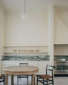 a table and two chairs in a room