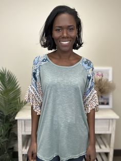 The Keep It Casual Top by GIGIO is such a fun top. It features a round neckline, straight raw cut hemline, and animal and geo multi printed ruffle short sleeves. The sleeves are trimmed in a nice crochet lace band. 100% Polyester Contrast: 100% Rayon Trim: 100% Cotton Missy Fit S 0/6-8 M 6-10 L 10-16 The Ladies of ALB Sizing: Model (short black hair) is a size S, 32” bust, 32C bra size and is photographed in a size S! Casual Flutter Sleeve Tops With Lace Trim, Bohemian Short Sleeve Top With Crochet Trim, Bohemian Printed Top With Flutter Sleeves, Casual Short Sleeve Tops With Mixed Print, Spring Mixed Print Short Sleeve Tops, Spring Short Sleeve Tops With Mixed Print, Casual Printed Tops With Butterfly Sleeves, Patterned Short Sleeve Tops With Ruffles, Patterned Ruffle Tops With Short Sleeves