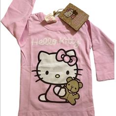 Hello Kitty Organic Long Sleeve Shirt 100% Organic Cotton Fiber Color Pink Size 6-12 Months $20 Pink Long Sleeve Top With Cat Design, Pink Long Sleeve Tops With Cat Design, Hello Kitty Long Sleeve Cotton Top, Long Sleeve Cotton Hello Kitty Top, Hello Kitty Shirts, Hello Kitty Shirt, Christmas Long Sleeve Shirts, Hello Kitty Pink, Long Sleeve Kids