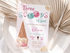 there's a scoop of ice cream on top of a pink and green birthday card