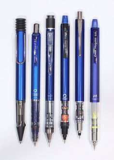 five different types of pens lined up in a row