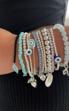 Evil Eyes Jewellery, Silver Jewellery Aesthetic Bracelets, Silver Summer Jewelry Aesthetic, Bracelet Eye Evil, Evil Eye Jewellery Aesthetic, Where To Buy Bracelets, Silver Evil Eye Jewelry, Evil Eye Bracelet Stack, Holiday Bracelets Aesthetic