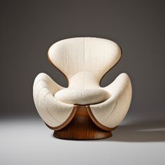 the chair is made out of wood and fabric