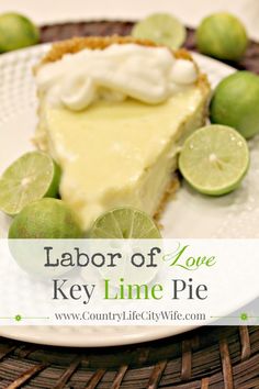 a slice of key lime pie on a white plate with limes around it and the words, labor of love key lime pie