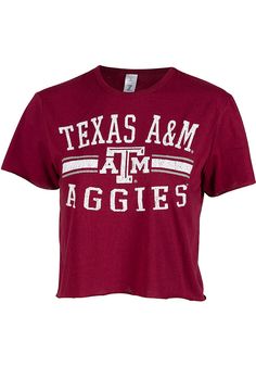 Let everyone know who you root for in this Texas A&M Aggies Maroon Divine Short Sleeve T-Shirt! This Texas A&M Short Sleeve Tee features a distressed center front team name graphic. Crop length, Raw edge details, Ribbed collar, 65% Polyester/35% Cotton, 4 Summer Fan Gear Graphic Tee Tops, Summer Fan Gear Graphic Tee, Summer Graphic Tee Tops For Fans, Cropped Cotton T-shirt With Short Sleeves, Collegiate Summer Fan Gear Tops, Collegiate Style Summer Fan Gear Tops, Short Sleeve Cropped T-shirt With Letter Print For College, Cropped Short Sleeve Letter Print T-shirt For College, Cropped Short Sleeve T-shirt With Letter Print For College