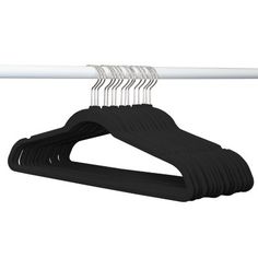 a black and white hanger with gold pins