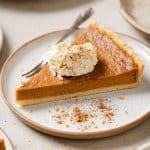 a slice of pumpkin pie on a plate