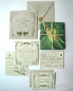 the wedding stationery is laid out on top of each other