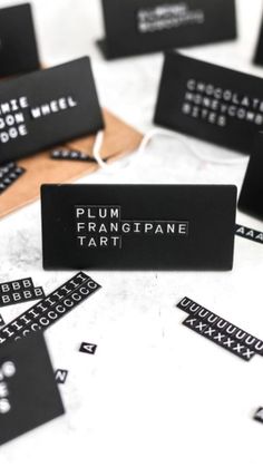 black and white business cards on top of each other with the words plum frang pagne tart