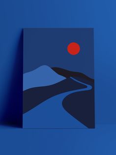 a card with an image of a mountain and a red sun in the sky above it