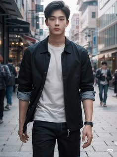 a young man is walking down the street