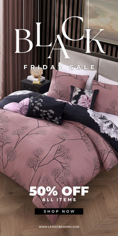 the bedding is pink and black with flowers on it