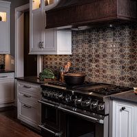 a kitchen with an oven, stove and cabinets in the middle of it's counter space